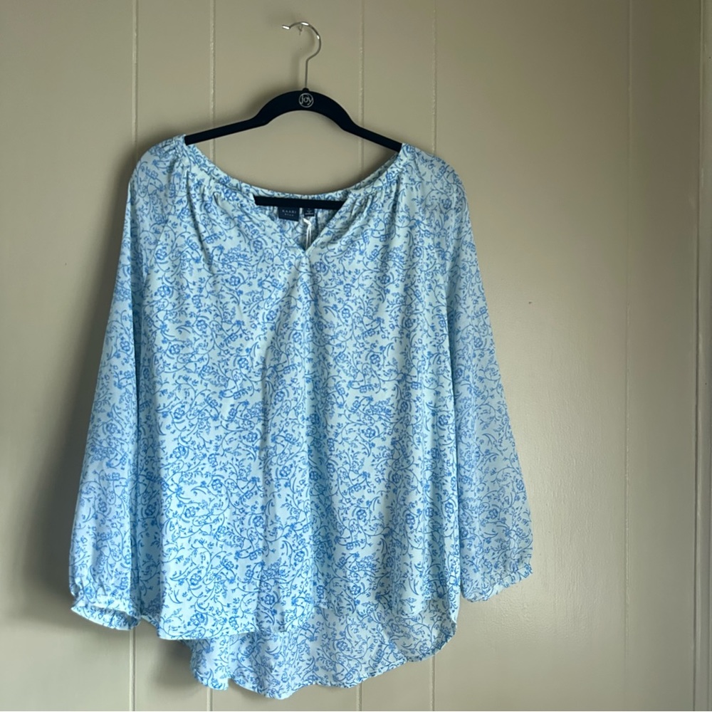 Beautiful NWT Kaari Blue Peasant top, high low.